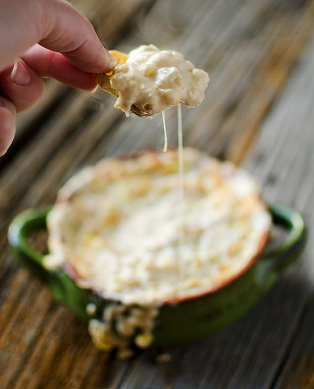 Corn Green Chilli Con Queso is an easy dip prepared in your Crock Pot that is sure to be a crowd-pleaser with crunchy sweet corn, flavorful green chilies and melted cheddar and queso fresco!