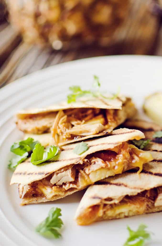 Crock Pot BBQ Chicken Pineapple Quesadillas on plate garnished with cilantro