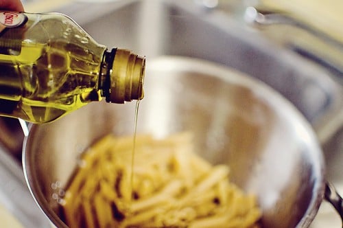 Penne in bowl with olive oil