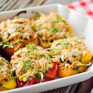 Light Chipotle Chicken & Rice Stuffed Peppers in baking dish served on table