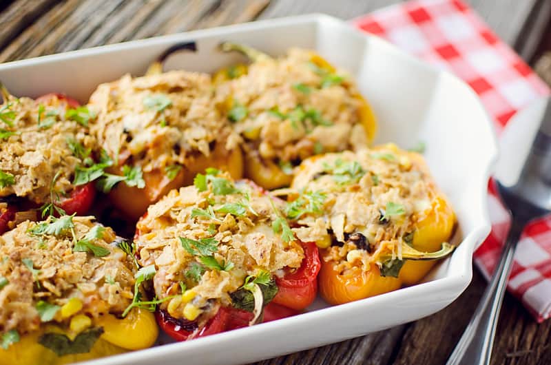 Light Chipotle Chicken & Rice Stuffed Peppers in baking dish served on table