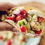 Greek Chicken Tacos with Whipped Feta held in hand