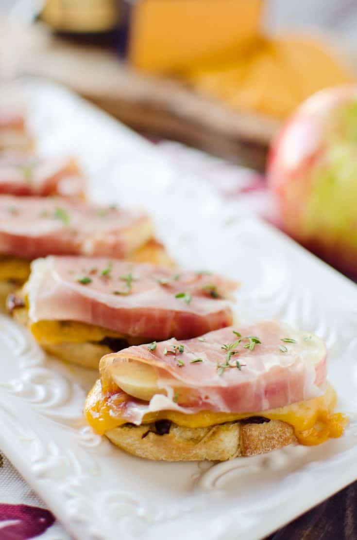 Caramelized Onion & Cheddar Crostinis with Prosciutto Wrapped Apples