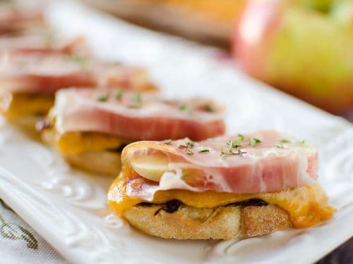 Caramelized Onion & Cheddar Crostinis with Prosciutto Wrapped Apples - Krafted Koch - A sophisticated appetizer made with smooth Boar's Head Sharp Cheddar Cheese, a recipe perfect for the holidays!