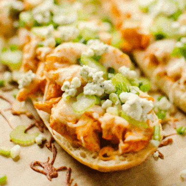 cheesy buffalo chicken french bread topped with gorgonzola and celery
