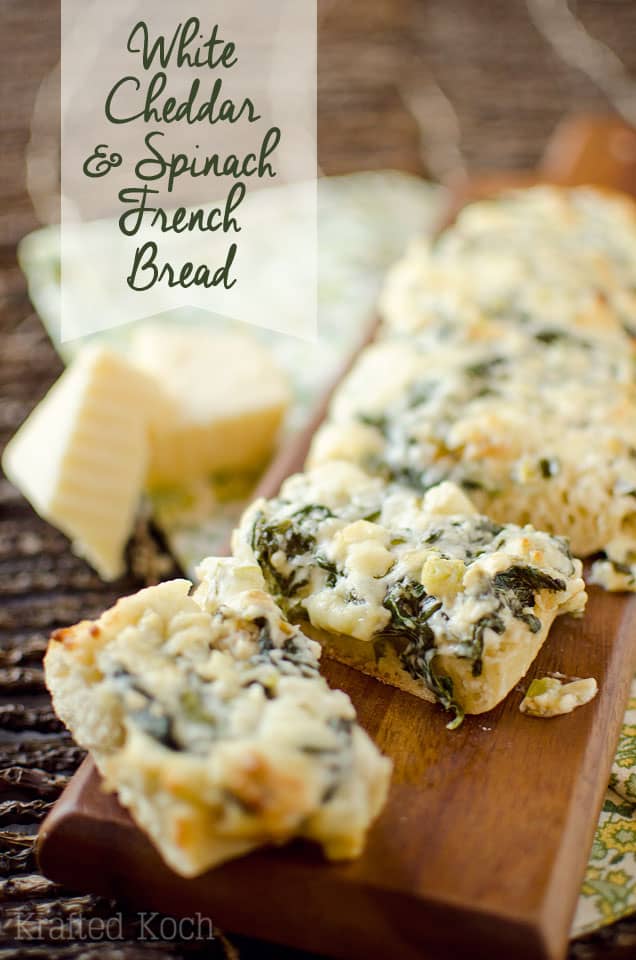 White Cheddar & Spinach French Bread - Krafted Koch - Crusty French bread topped with baby spinach sautéed in butter with garlic and green onions and mixed with extra sharp white cheddar for a decadent appetizer or vegetarian entrée recipe your guests will devour!