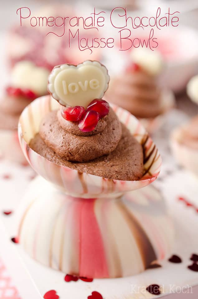 Pomegranate Chocolate Mousse Bowls are the perfect little cups of dessert with pomegranate chocolate mousse filling up these adorable bowls made from swirled Ghirardelli wafers and topped with pearls of pomegranate and chocolate hearts for a festive and colorful Valentine's recipe that will impress your loved one! #Valentines #Ghirardelli #Chocolate #Dessert