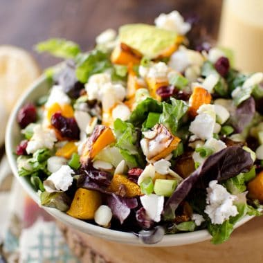 Roasted Squash & Cranberry Salad - Krafted Koch - A flavorful harvest salad loaded with roasted butternut squash, creamy goat cheese and dried cranberries for a meatless meal that will satisfy all your senses!