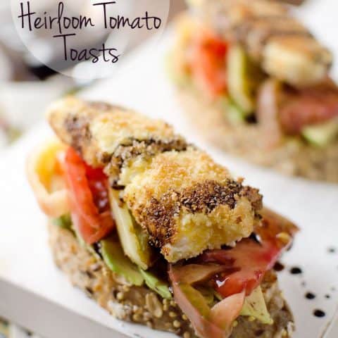 Fried Goat Cheese & Heirloom Tomato Toasts - An amazing meal you can enjoy for breakfast, lunch or dinner. This vegetarian recipe is loaded with fried goat cheese, heirloom tomatoes, avocados and balsamic reduction for a fresh meal bursting with flavor. #Vegetarian #Breakfast #Lunch #Dinner