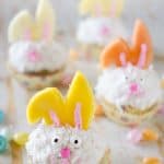 Light Coconut Cream Easter Bunny Cupcakes - A fun spring recipe with lightened up coconut cream cupcakes topped with bunny ears made from fruit, using Bakery Crafts Easter Bunny Cookie Cupcake Decoration Kit, for a holiday treat kids and adults will LOVE! #Easter #Cupcakes #Light #Fruit