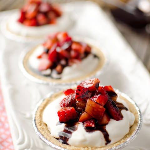 Skinny Mini Strawberry Balsamic Cream Pies are the perfect summer recipe for a light and healthy dessert that is loaded with sweet strawberries and balsamic reduction for amazing flavor.
