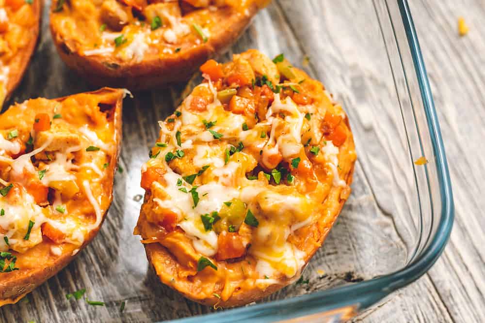 twice baked buffalo chicken sweet potatoes in pan