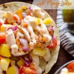 Chipotle Shrimp Tacos with Mango Salsa - A fresh and delicious dinner recipe that can easily be whipped up in 15 minutes for a meal bursting with fresh fruit and vegetables topped with a spicy chipotle sauce. #Tacos #Healthy #Light #DInnerIdea