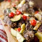 Greek Meatball & Veggie Skillet - The Creative Bite - A hearty but healthy skillet filled with lean ground beef and spinach meatballs and roasted veggies, topped with feta for a delicious and wholesome dinner recipe the whole family will love! #Healthy #Beef #Light #Meatballs #21DayFixApproved