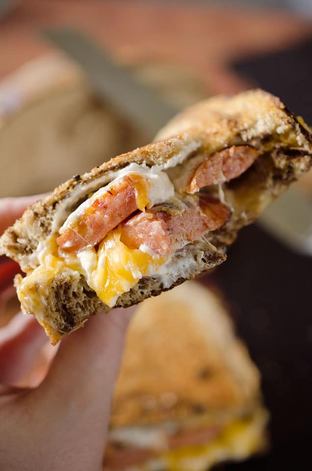 Smoked Sausage Triple Grilled Cheese has juicy sausage and creamy gouda, cheddar and cream cheese layered between two pieces of marble rye bread for a rich and gooey grilled cheese that will blow your mind!