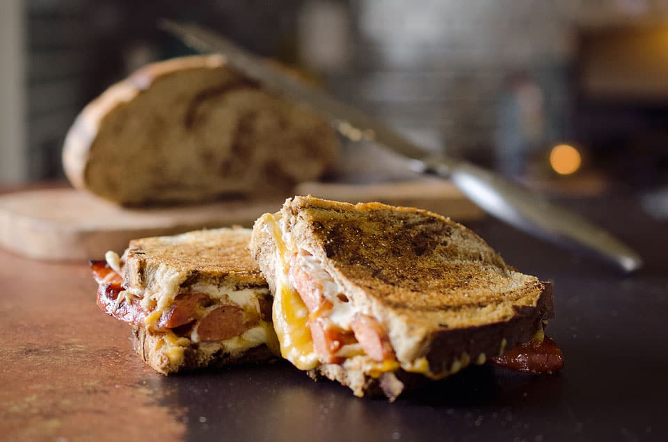 Smoked Sausage Triple Grilled Cheese has juicy sausage and creamy gouda, cheddar and cream cheese layered between two pieces of marble rye bread for a rich and gooey grilled cheese that will blow your mind!