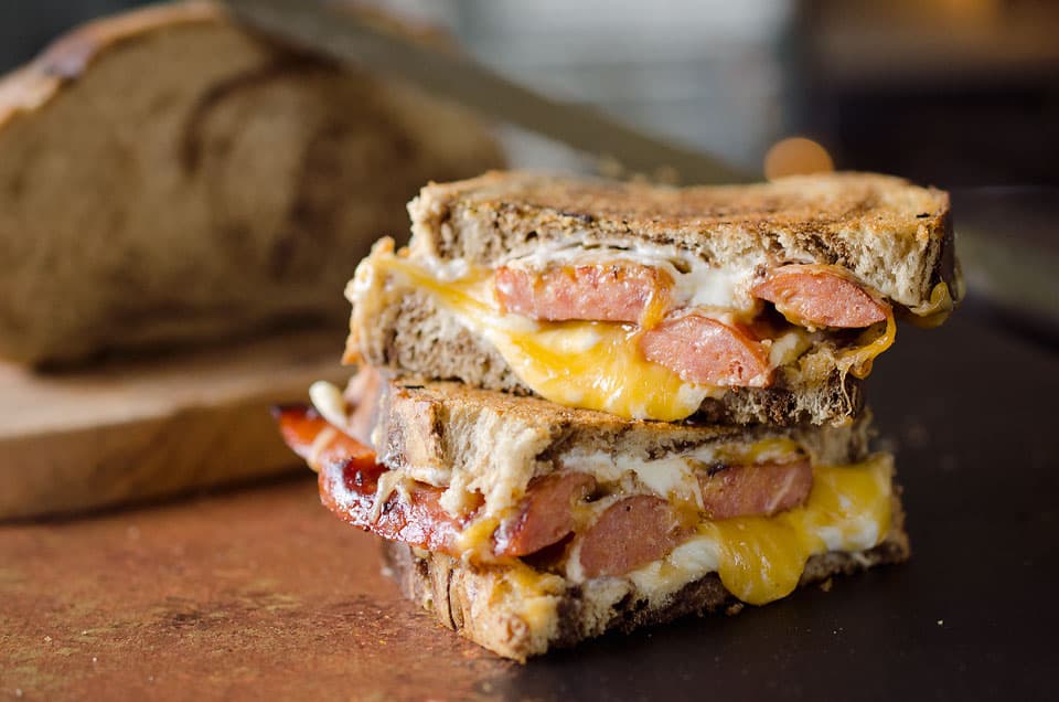 Smoked Sausage Triple Grilled Cheese has juicy sausage and creamy gouda, cheddar and cream cheese layered between two pieces of marble rye bread for a rich and gooey grilled cheese that will blow your mind!