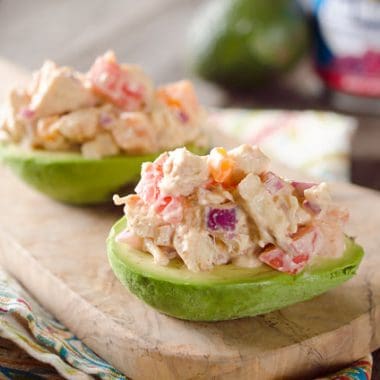 Chipotle Chicken Salad Stuffed Avocados - A low-carb recipe full of fresh vegetables and flavor from a spicy chipotle sauce for a light and healthy packed lunch or dinner idea!