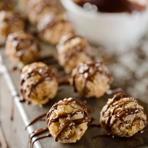 Coconut Macadamia Bites are rich little candies made with toasted coconut and macadamia nuts, caramelized sweetened condensed milk and sea salt all drizzled with dark chocolate for the perfect sweet and salty dessert! #Sweets #Coconut #Dessert #Chocolate #Candy
