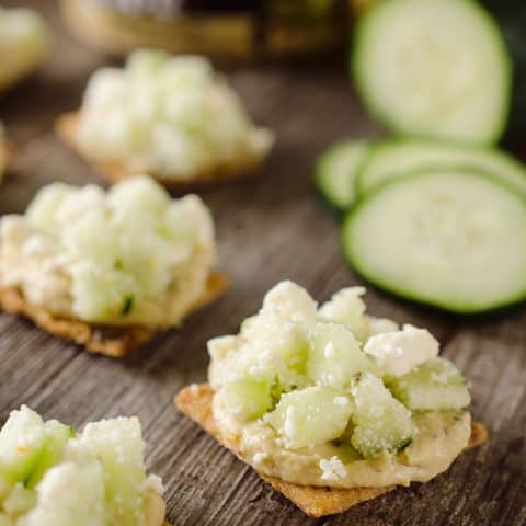 Cucumber Feta Bites are an easy appetizer or snack that are not only healthy, but satisfying and delicious! #Triscuit #Appetizer #Hummus #Cucumber #Snack #Healthy