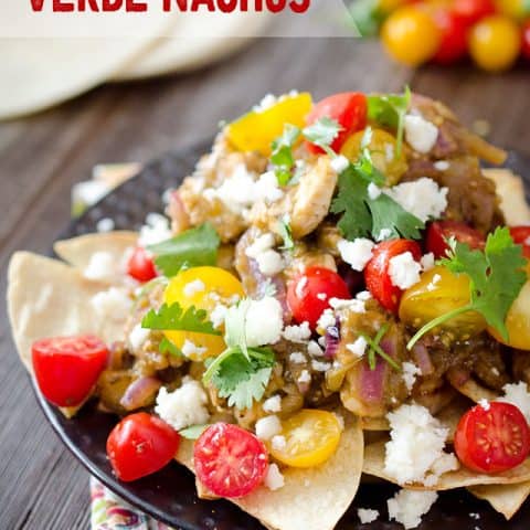 Light Chicken Verde Nachos are a healthy appetizer or fun dinner idea with a pile of baked corn tortillas topped with chicken breasts in a salsa verde and fresh tomatoes and queso fresco. #Light #Chicken #Healthy #Nachos