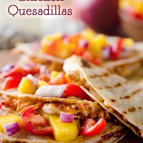 Mango BBQ Chicken Quesadillas are an easy dinner idea bursting with bold flavors from homemade Mango BBQ Sauce and topped with fresh Mango Salsa #Mango #Chicken #Quesadilla #Easy