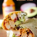 Healthy Buffalo Chicken Wrap - A light and healthy wrap filled with buffalo chicken breasts, Greek yogurt, bleu cheese crumbles, broccoli slaw, avocado and tomatoes for an easy lunch with bold flavor! #Buffalo #Chicken #Wrap #Lunch #Healthy #Light