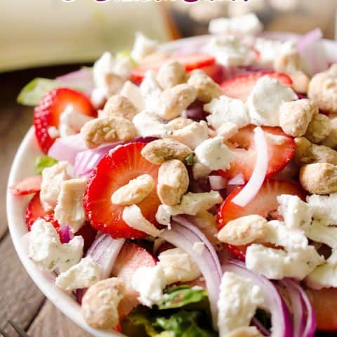 Strawberry & Coconut Cashew Salad is a fresh and healthy dinner salad recipe with ripe strawberries, red onions, goat cheese and coconut cashews. #Salad #Entree #Dinner #Light #Healthy