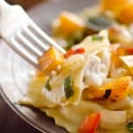 Roasted Squash & Sausage Ravioli is easy weeknight comfort food with roasted butternut squash, onions and bell peppers tossed with sausage ravioli and a butter sage sauce. #Squash #Sausage #Pasta #ComfortFood #Ravioli