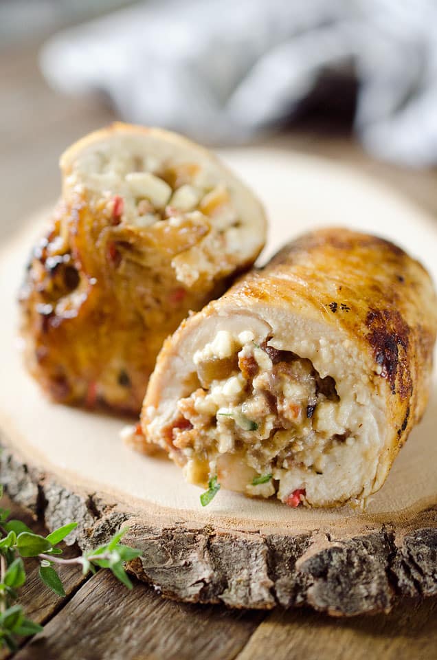 Chicken, Bacon & Feta Roulade is a surprisingly simple dinner idea made with a tender chicken breast wrapped around a bacon, feta, thyme and caramelized onions. #Chicken #Roulade