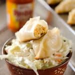 Buffalo Chicken Potstickers are a surprisingly easy and healthy dinner with chewy wrappers filled with lean ground chicken, vegetables and buffalo sauce.