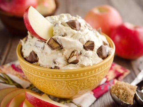 Candy Bar Apple Dip is the perfect dessert recipe to use up all of that leftover Halloween candy! #Candy #Apples #Dip #Dessert