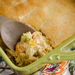 Cheesy Chicken Pot Pie Casserole is a quick and easy weeknight dinner idea with only 5 ingredients! Creamy chicken and vegetables with Campbell's Cheddar Broccoli Chicken Oven Sauce are topped with a flaky crescent crust for a delicious recipe the whole family will love!