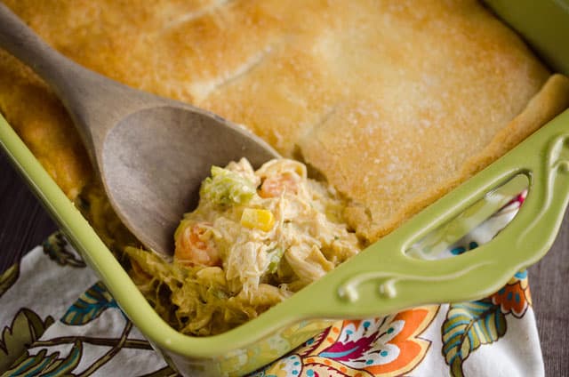 Cheesy Chicken Pot Pie Casserole is a quick and easy weeknight dinner idea with only 5 ingredients! Creamy chicken and vegetables with Campbell's Cheesy Broccoli Chicken Oven Sauce are topped with a flaky crescent crust for a delicious recipe the whole family will love! #Chicken #PotPie #EasyDinner