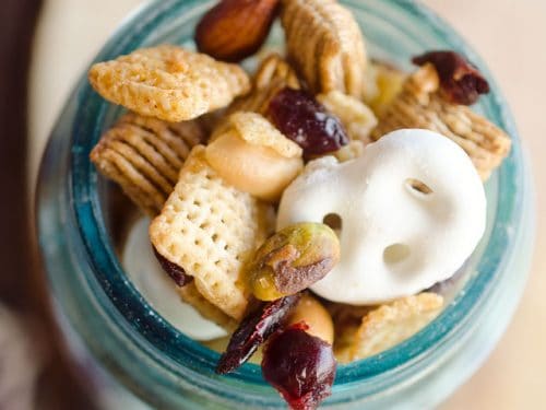 Sweet & Salty Cranberry Snack Mix is a party favorite filled with buttery cinnamon Chex Mix, yogurt covered pretzels, dried cranberries and mixed nuts.
