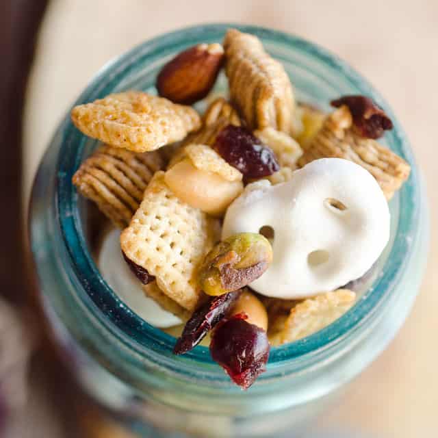Sweet & Salty Cranberry Snack Mix is a party favorite filled with buttery cinnamon Chex Mix, yogurt covered pretzels, dried cranberries and mixed nuts. 