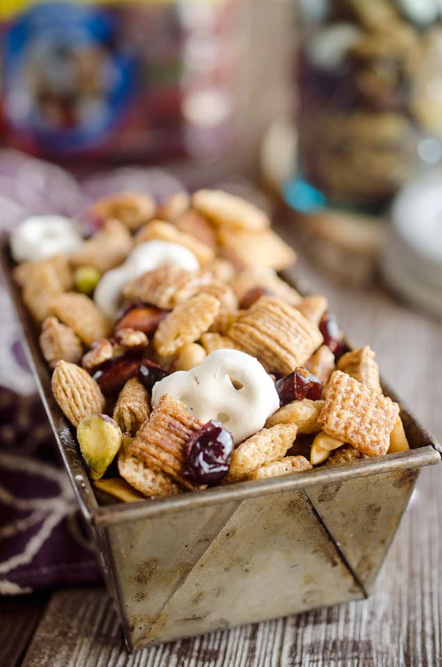 Sweet & Salty Cranberry Snack Mix is a party favorite filled with buttery cinnamon Chex Mix, yogurt covered pretzels, dried cranberries and mixed nuts.