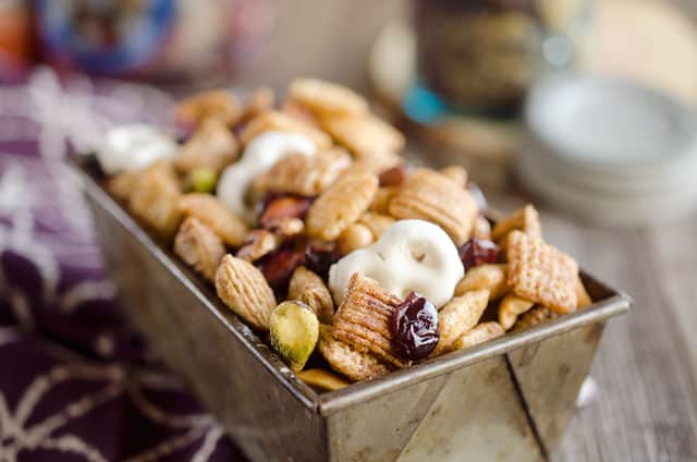 Sweet & Salty Cranberry Snack Mix is a party favorite filled with buttery cinnamon Chex Mix, yogurt covered pretzels, dried cranberries and mixed nuts. 