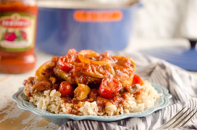 Rustic Italian Chicken Cacciatore is a hearty comfort food, made with Bertolli tomato & basil sauce, red wine and loads of vegetables. Served over brown rice, it is a dinner the whole family will love and you can feel good about! #Chicken #Italian #Rustic #Bertolli #Healthy #TasteOfItaly