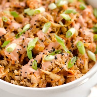 Turkey Egg Roll Bowl with Creamy Sriracha is an amazingly healthy and delicious bowl of goodness perfect for lunch or dinner! Sauteed cabbage, carrots, onion and ground turkey are tossed with an Asian inspired sauce and topped with a creamy Greek yogurt sriracha mayo sauce.