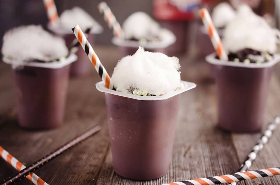 Witch's Brew Pudding Cups - These witch's cauldrons are made with delicious chocolate Snack Packs topped with crushed oreos, bubble sprinkles and cotton candy for a spooky Halloween treats that kids and adults will all love! #Halloween #Pudding #Chocolate