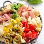 Antipasto Tortellini Pasta Salad is hearty side dish that is a perfect addition to any holiday meal, loaded with prosciutto, salami, Crystal Farms cheese, tomatoes, olives and more!