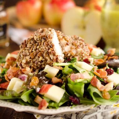 Harvest Salad with Pecan Crusted Chicken is full of great fall flavors including dried cranberries, golden raisins, bacon, chopped apples and a tender chicken breast crusted with toasted pecans.