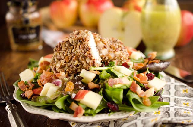 Harvest Salad with Pecan Crusted Chicken is full of great fall flavors including dried cranberries, golden raisins, bacon, chopped apples and a tender chicken breast crusted with toasted pecans. 