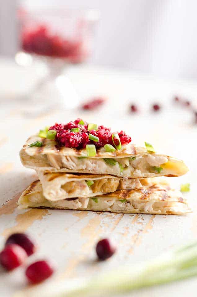 Light Cranberry Turkey Quesadilla are a healthy and easy meal perfect for using up all of that leftover turkey from Thanksgiving! Fill a light tortilla with turkey, havarti cheese and green onions and top it with cranberry salsa for a delicious and unique dinner after the holidays!