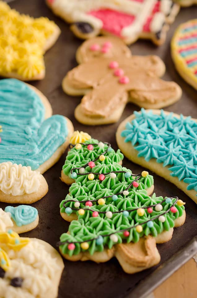 cut out sugar cookies frosted on baking pan