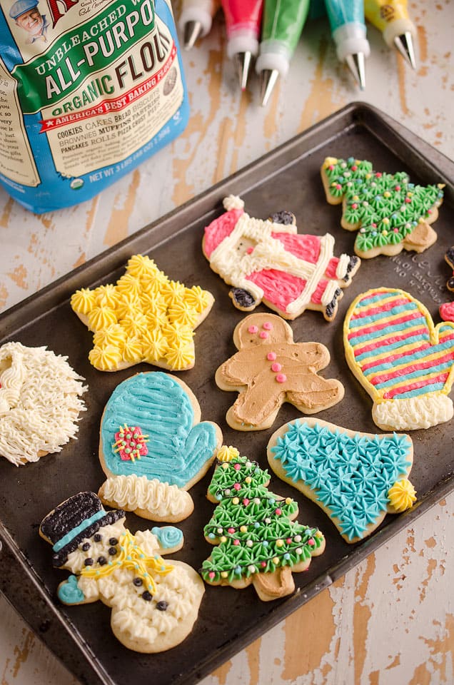 Old Fashion Sour Cream Cut-Out Cookies frosted with buttercream on cookie sheet