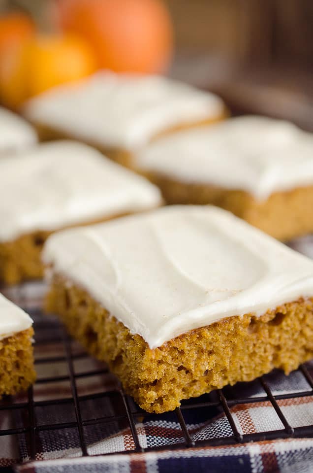 Pumpkin Cake Bars are a delicious fall treat with a light and fluffy pumpkin spice cake mix topped with decadent cream cheese frosting!