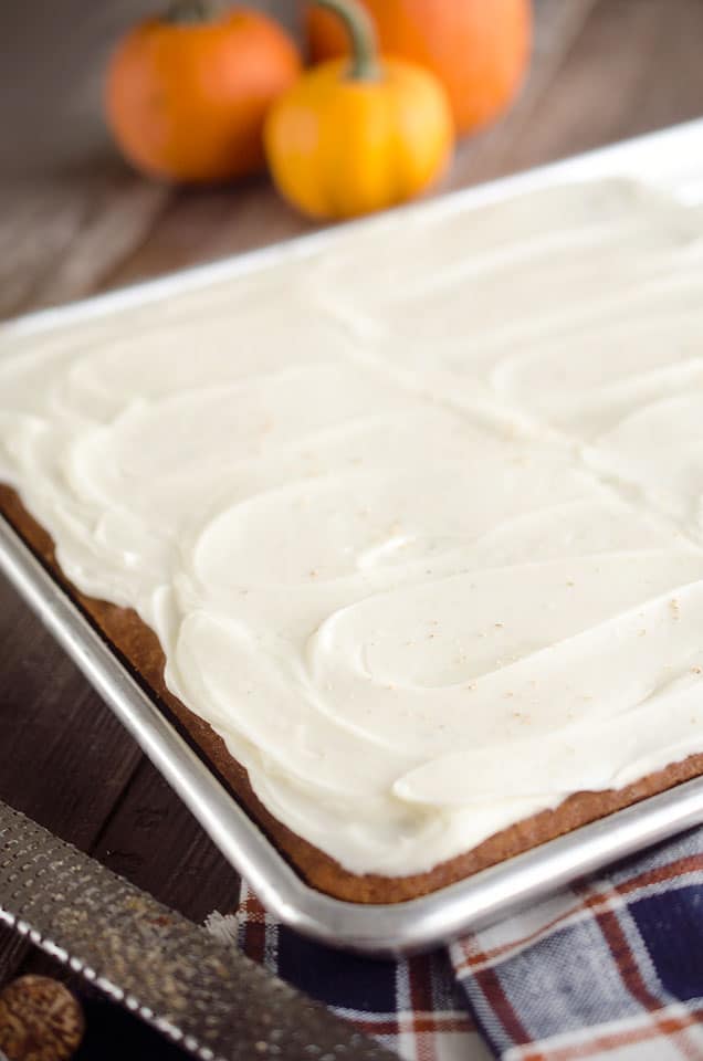 Pumpkin Cake Bars are a delicious fall treat with a light and fluffy pumpkin spice cake mix topped with decadent cream cheese frosting!