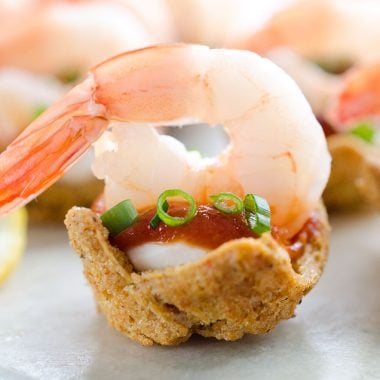 Light Shrimp Cocktail Bites are the perfect finger food to celebrate a holiday party. These individual bites of shrimp cocktail are lightened up with reduced fat cream cheese and Greek yogurt for a delicious and guilt free finger food you can enjoy!